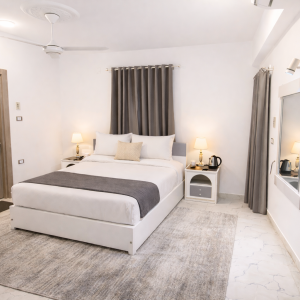 Standard GREY room - 1 Queen bed - small balcony - Rear view